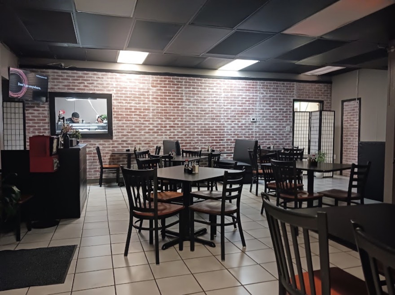 Contemporary dining room and sushi bar inside Kaizen Japanese Cuisine